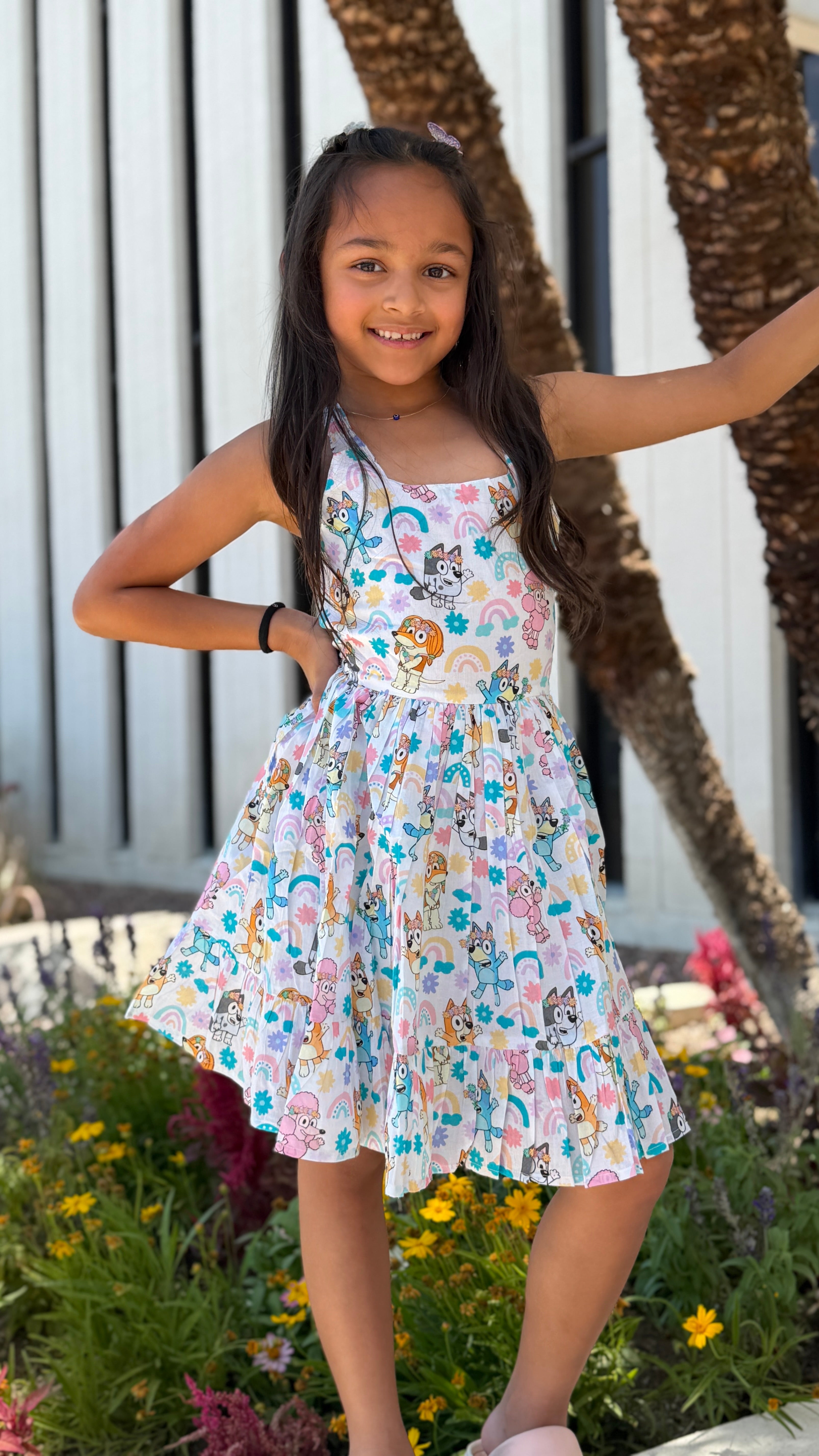 Girls Twirl Dress — White Cartoon Character Print with Ruffle Hem