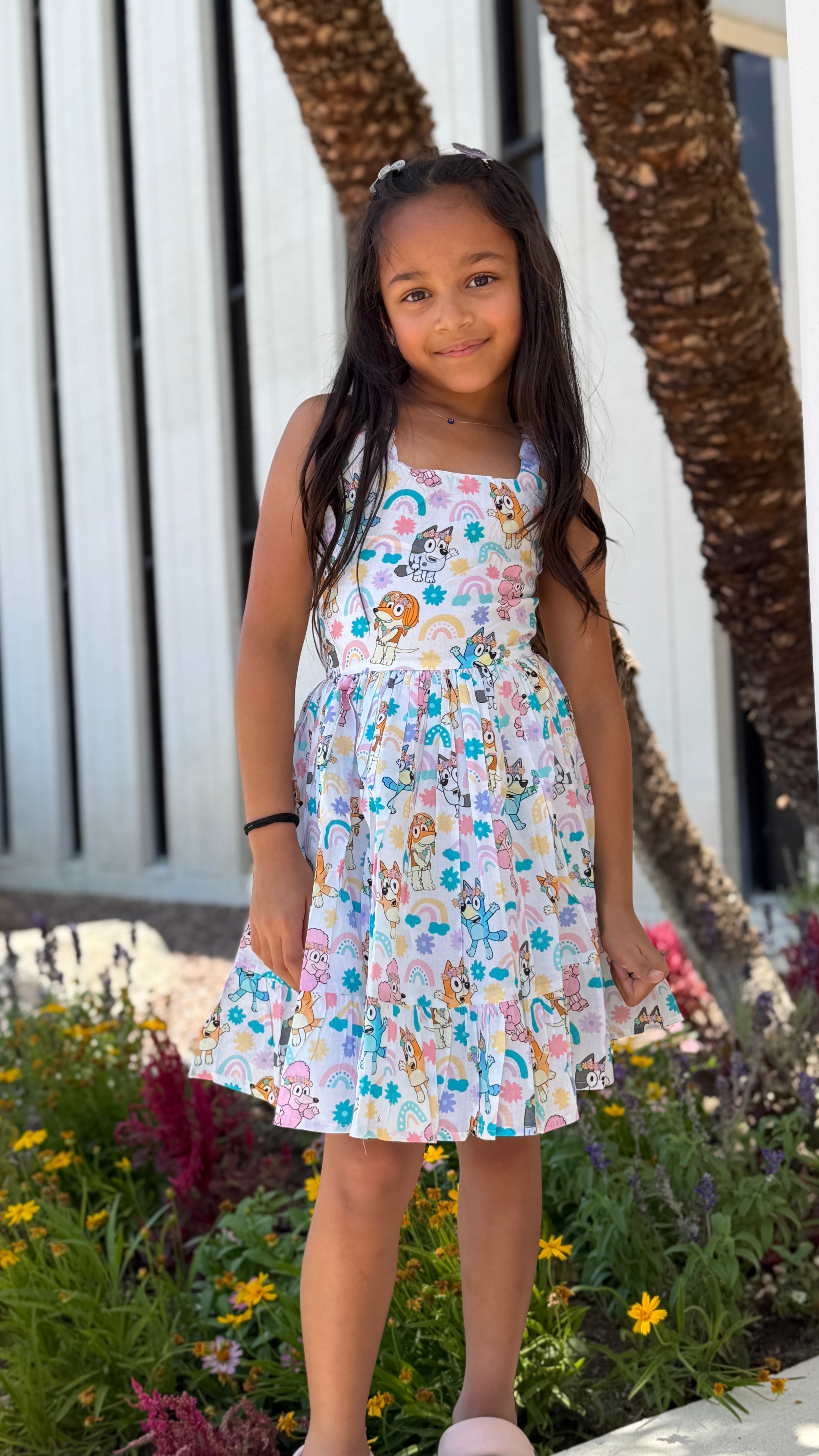 Girls Twirl Dress — White Cartoon Character Print with Ruffle Hem