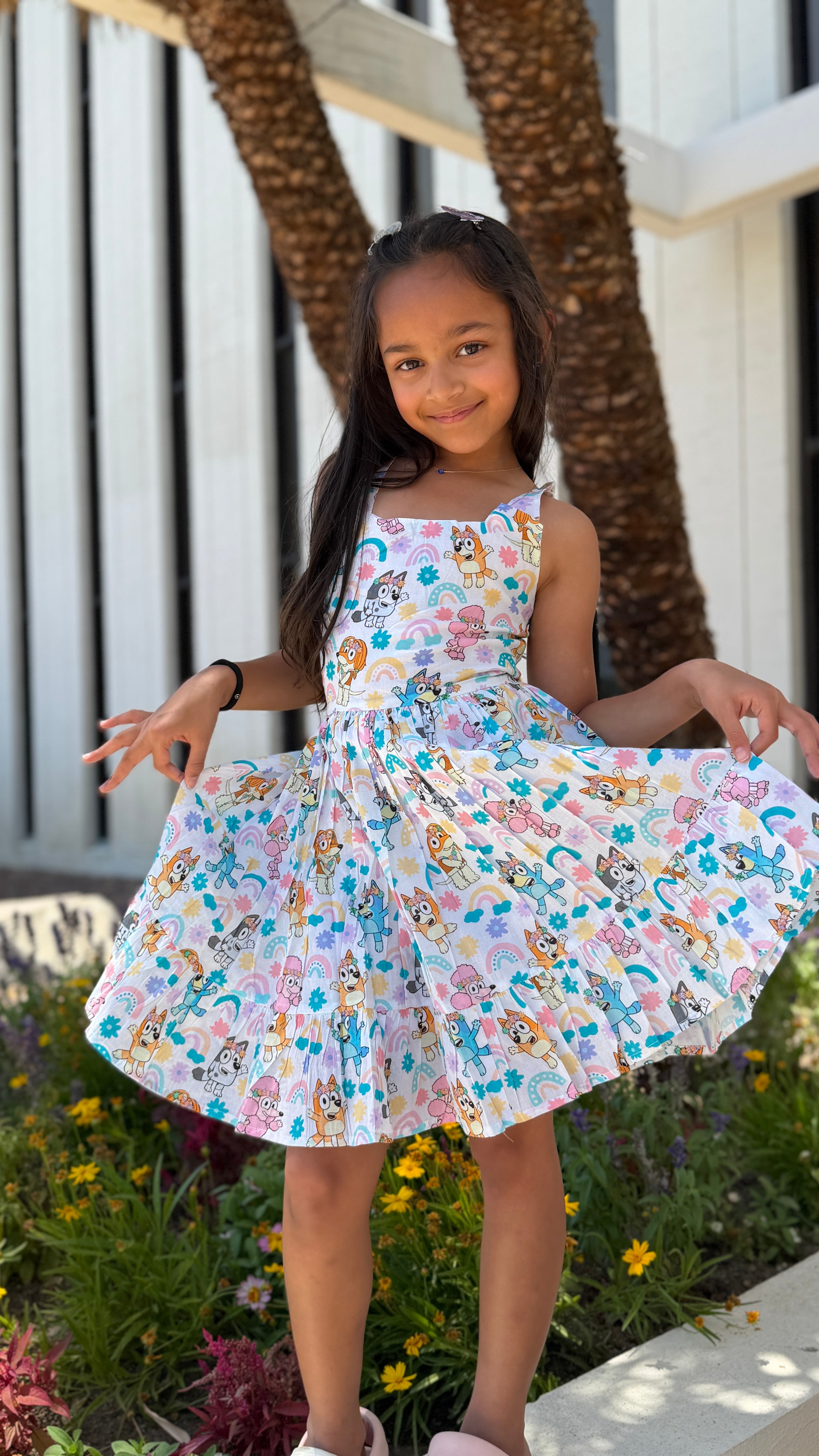 Girls Twirl Dress — White Cartoon Character Print with Ruffle Hem