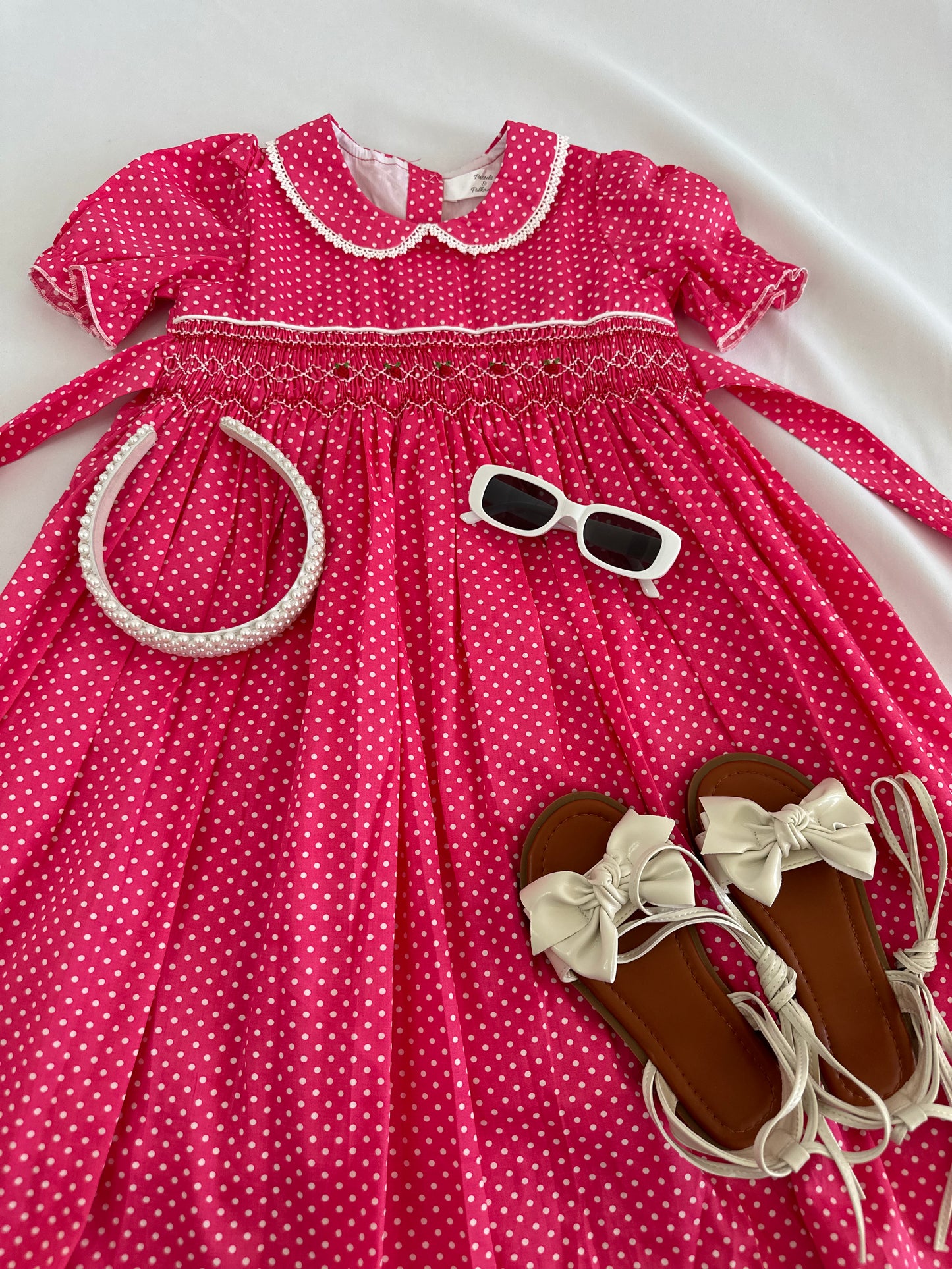 Adorable smocked polkadots dress with hand embroidered flower details