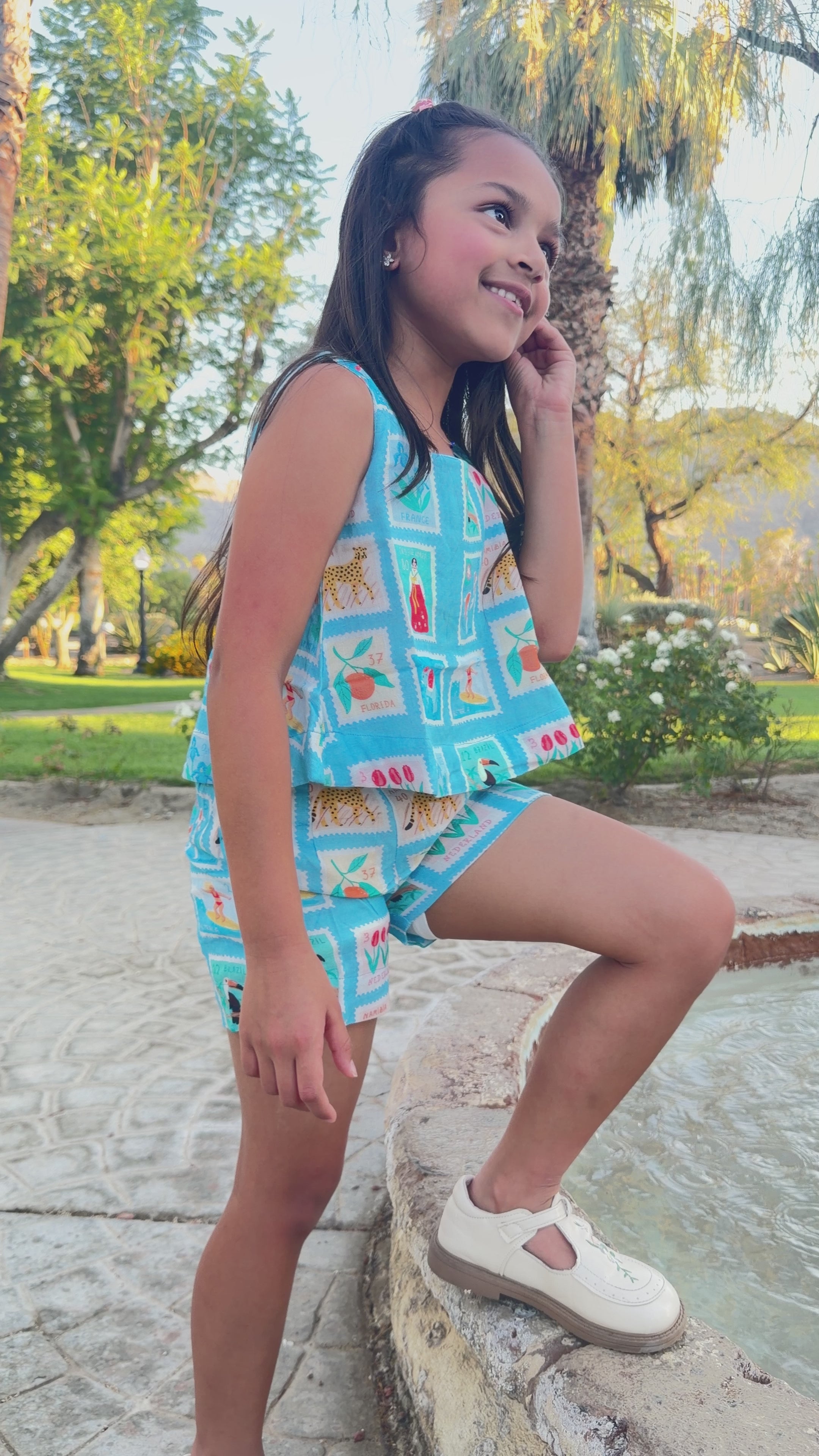 Load video: Girls Top and Shorts Set — Sky Blue World Traveler Print